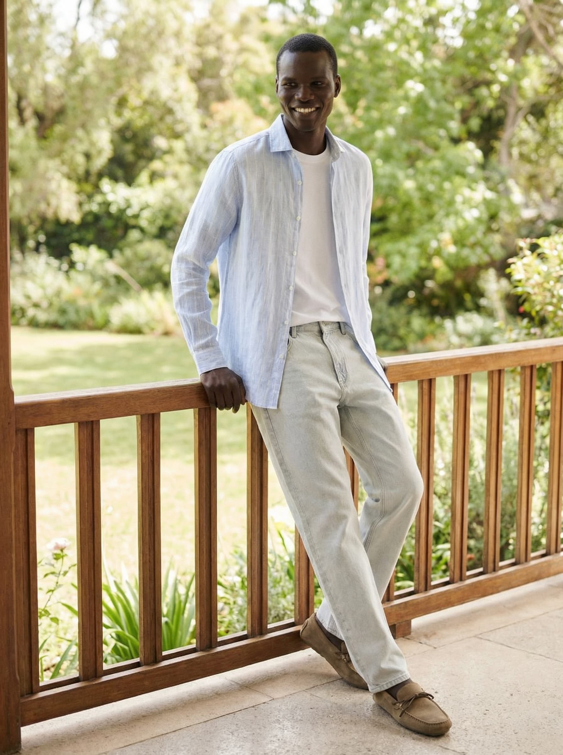 A man wearing shirt and white jeans