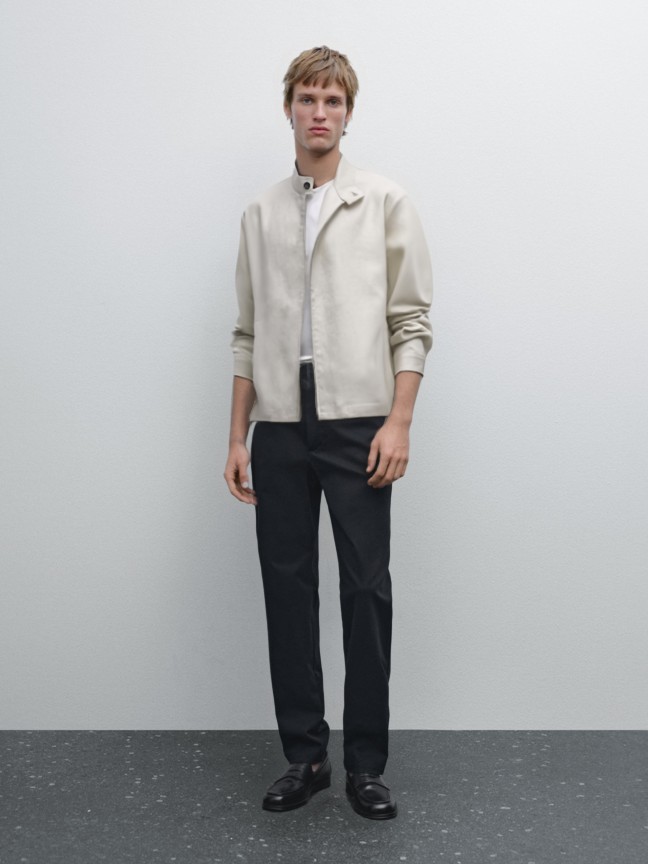 Virtual try-on result showing a stylish white jacket